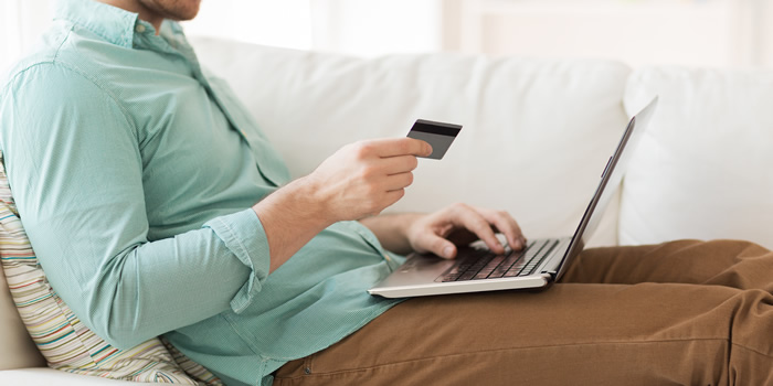 Man banking on couch