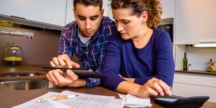 Couple Looking at Bills